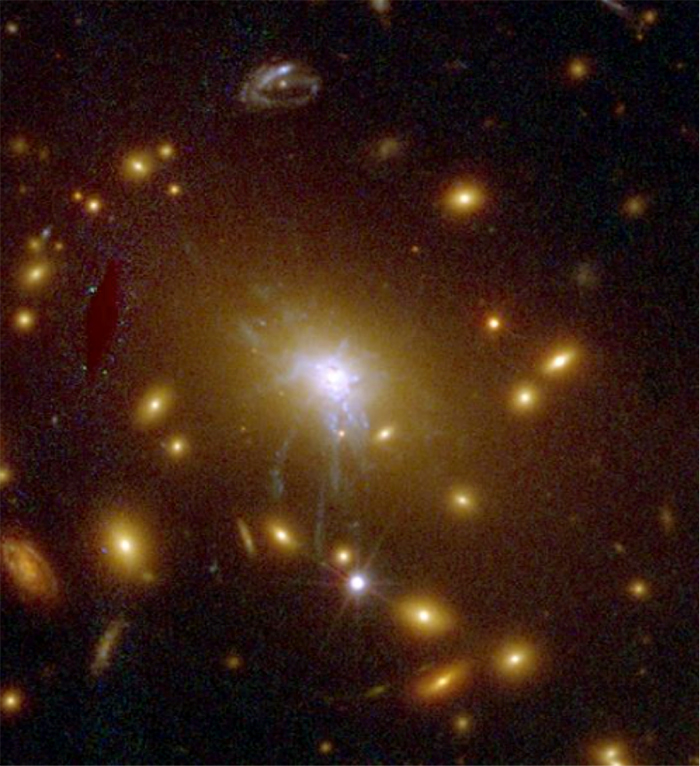 The center of a galaxy cluster that Larson studied at the Space Telescope Science Institute.