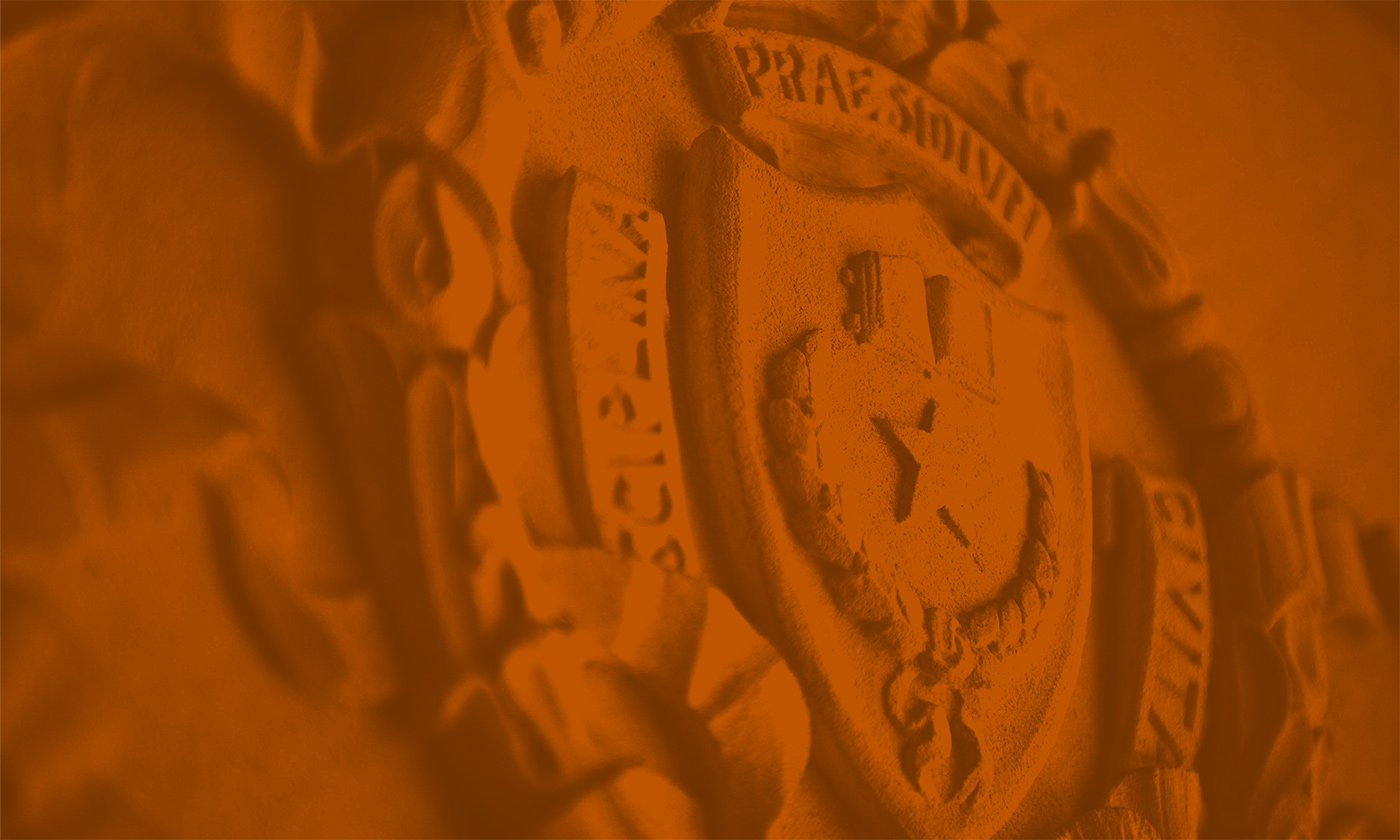 Seal of the University of Texas at Austin with a burnt orange filter on the image